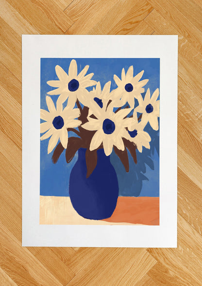 Daisies in blue vase